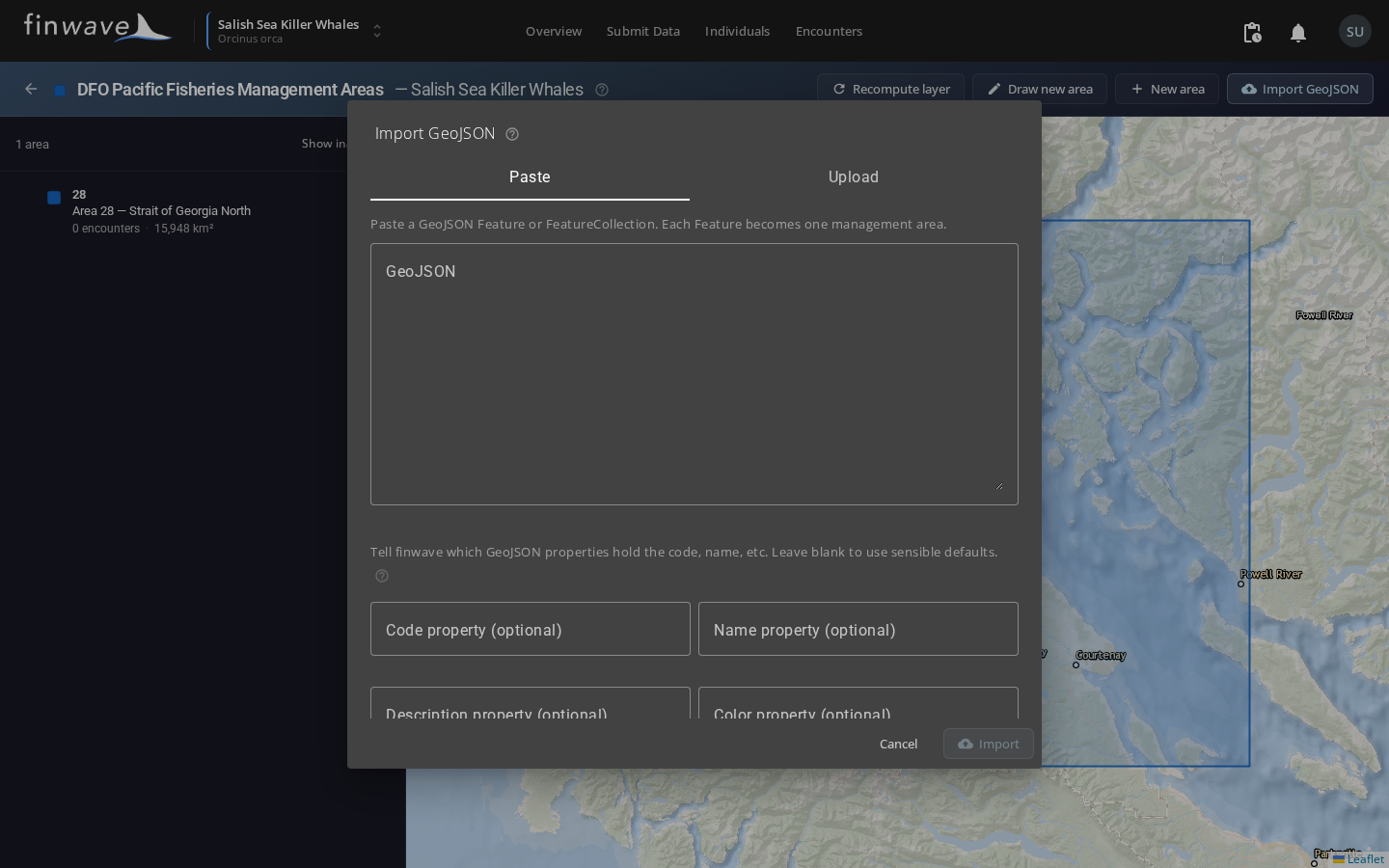 The Import GeoJSON dialog with the Paste tab active, the property-mapping fields below, and the parse-status confirmation row.